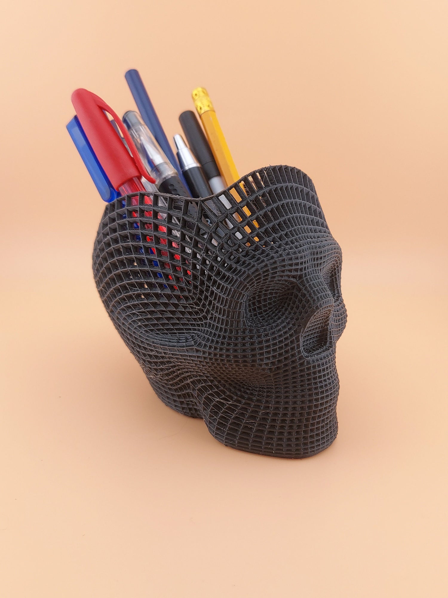 Inspired by ancient tales of sorcery and wizardry, our Mystical Skull Organizer brings a touch of enchantment to your workspace. That&#39;s the essence of our Skull Pen Pot – a gateway to creativity and imagination.